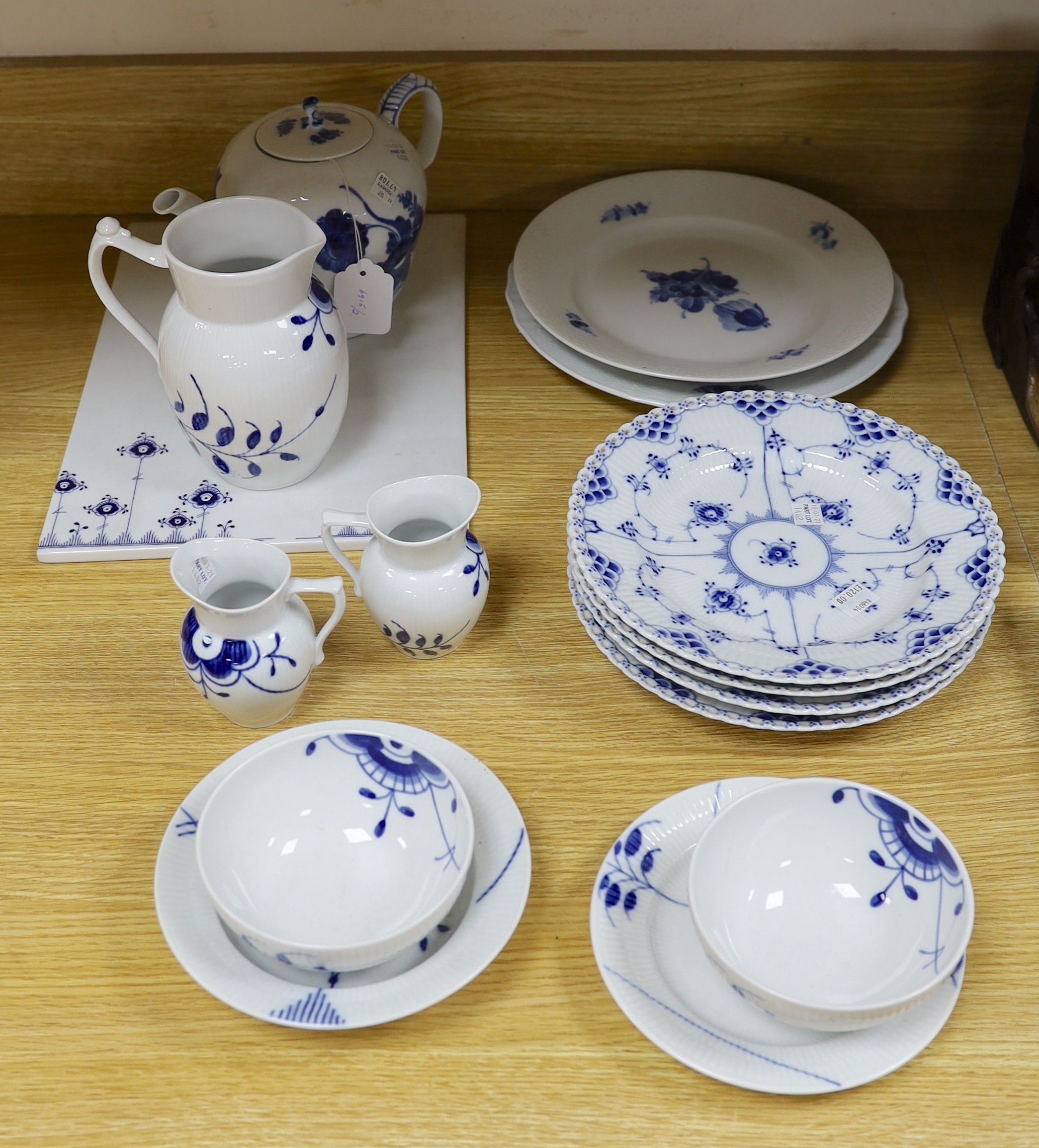 A collection of varying patterns of Royal Copenhagen blue and white tableware